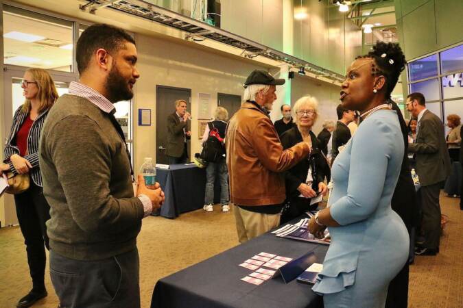 Philadelphia City Council candidate Naderah Griffin talks with voters at a candidate convention hosted by WHYY. (Emma Lee/WHYY)