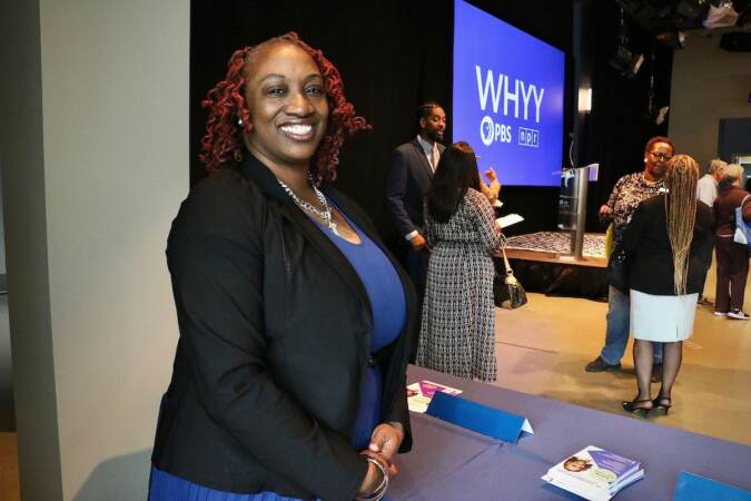 Philadelphia City Council candidate Deshawnda Williams talks with voters at a candidate convention hosted by WHYY. (Emma Lee/WHYY)