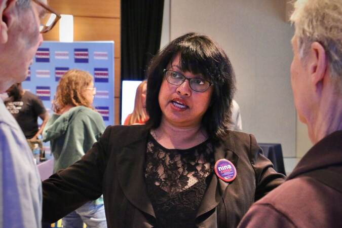 Philadelphia City Council candidate Nina Ahmad talks with voters at a candidate convention hosted by WHYY. (Emma Lee/WHYY)