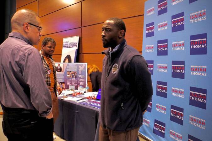 Philadelphia City Council candidate Isaiah Thomas (right) talks with voters at a candidate convention hosted by WHYY. (Emma Lee/WHYY)