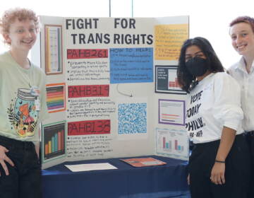 From left to right, Wes Allen, Kavi Shahnawaz, and Kai Willis-Carroll gave a presentation on transgender rights at the 1st Annual Philadelphia Civics Day. (Sam Searles/WHYY)