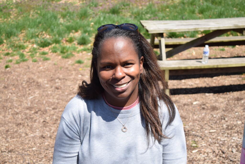 Dr. Banks sitting outside in the park.