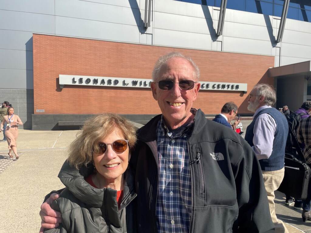 A couple stands outside of the Wilmington courthouse.