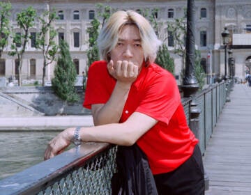 Ryuichi Sakamoto posing for a portrait in Paris in 1996.