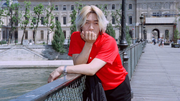 Ryuichi Sakamoto posing for a portrait in Paris in 1996.