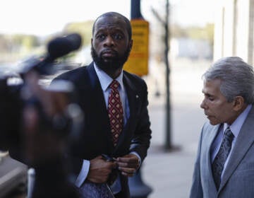 Pras Michel, former member of the Fugees, center, and his lawyer David Kenner arrive to federal court in Washington, D.C., on April 3, 2023.