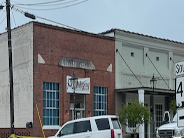 Police tape is seen outside the scene of a shooting in the city of Dadeville, Ala., that left at least four people dead and multiple others wounded