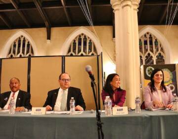 Jimmy DeLeon, Allan Domb, Helen Gym, and Rebecca Rhynhart sit in a row at a table.