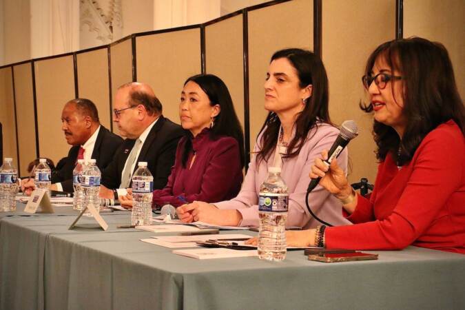 Loraine Ballard Morrill (right), moderator of the housing and development mayoral forum at the Broad Street Ministry poses questions to the four candidates who attended (from left) Jimmy DeLeon, Allan Domb, Hellen Gym, and Rebecca Rhynhart.