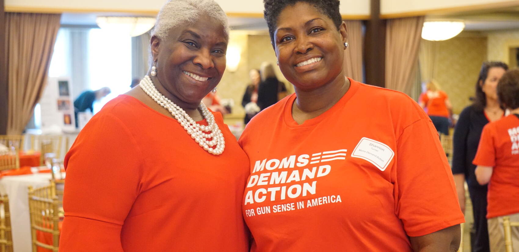 2 women posing at a Moms Demand Action event.