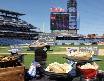 The spread of new food dishes at Citizens Bank Park, backed by the giant new Phanavision screen. (Ali Mohsen/Billy Penn)