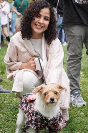 Briella Lugo-Adao and pet Kita wait in line for Japanese street corn