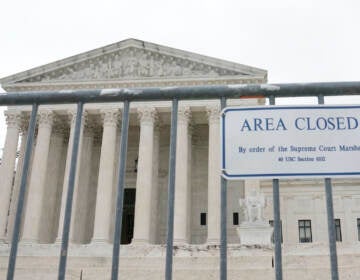A sign outside the Supreme Court building saying it's closed.