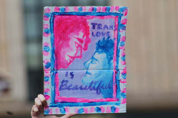 Students made signs to voice support for their transgender peers during a protest at City Hall on Apr. 25, 2023. (Cory Sharber/WHYY)