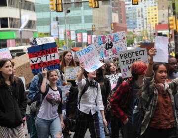 Students and transgender advocates circled around City Hall on Apr. 25, 2023, halting traffic and demanding multiple Pa. House Bills be vetoed. (Cory Sharber/WHYY)