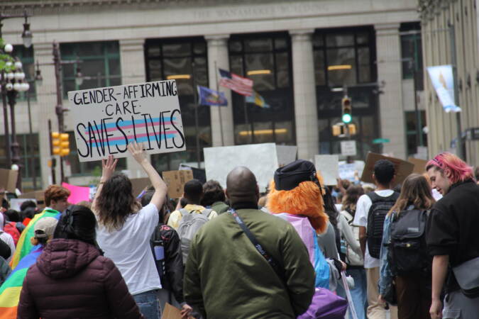 Students and transgender advocates circled around City Hall on Apr. 25, 2023, halting traffic and demanding multiple Pa. House Bills be vetoed. (Cory Sharber/WHYY)