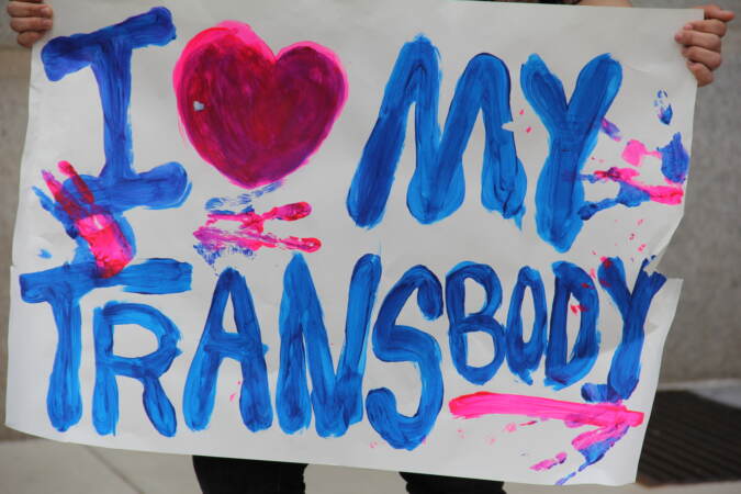 Students made signs to voice support for their transgender peers during a protest at City Hall on Apr. 25, 2023. (Cory Sharber/WHYY)
