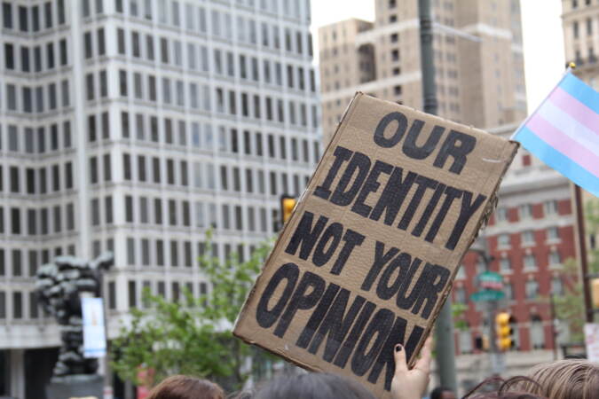 Students made signs to voice support for their transgender peers during a protest at City Hall on Apr. 25, 2023. (Cory Sharber/WHYY)