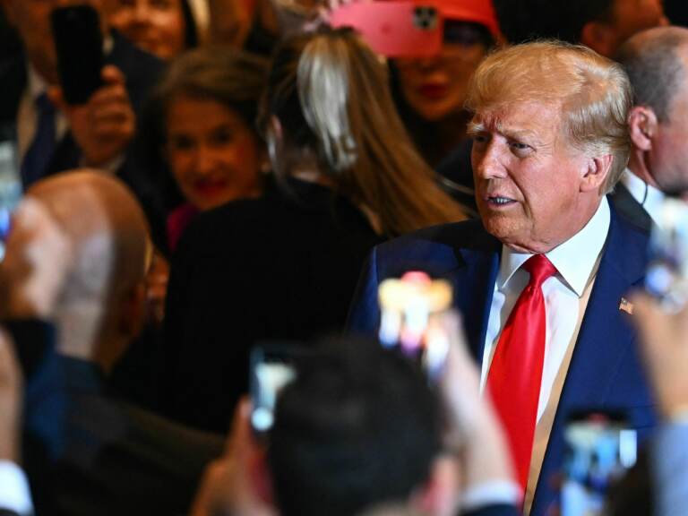 Former president Donald Trump arrives to speak during a press conference following his court appearance over an alleged 'hush-money' payment,