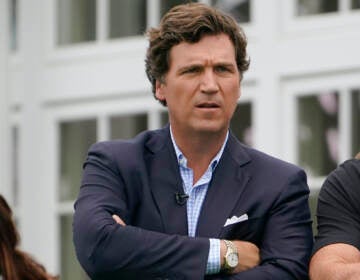 Tucker Carlson on a golf course.