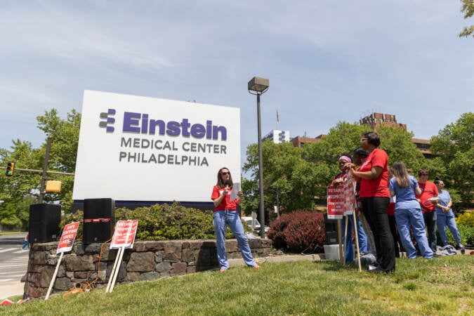 Danielle Chittenden speaks in front of a sign that reads Einstein Medical Center Philadelphia.