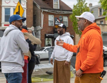 Joe Budd talking with members of the community at a block party.