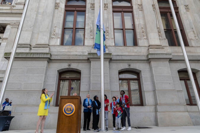 Kids from the Starfinder soccer club in Philadelphia helped raised the FiFA World Cup 2026 flag at City Hall on May 18, 2023. (Kimberly Paynter/WHYY)