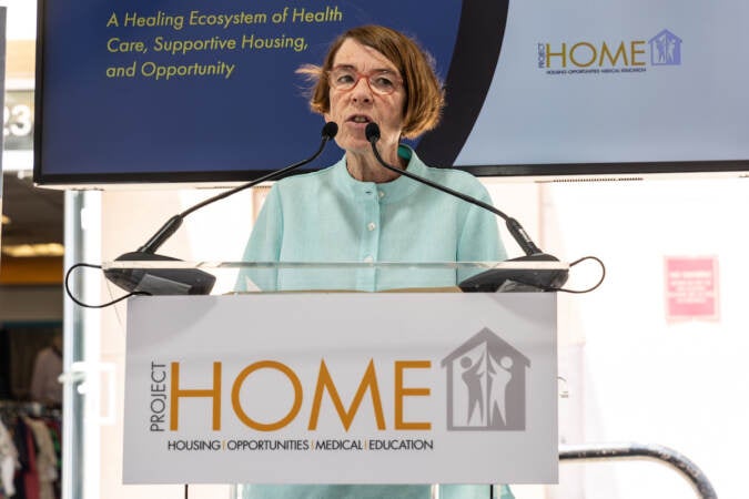 Sister Mary Scullion speaks at a podium.