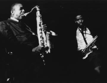 John Coltrane and Eric Dolphy with their saxophones.