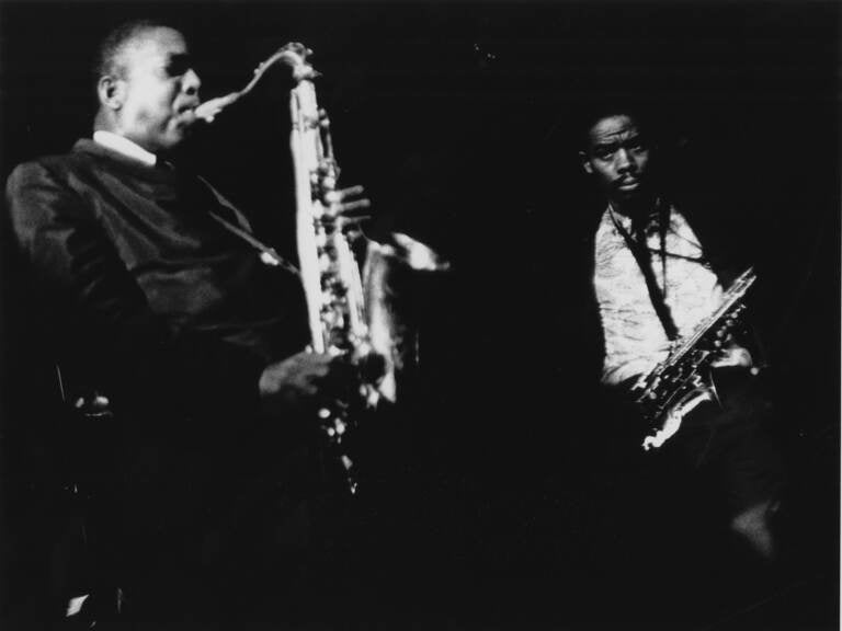 John Coltrane and Eric Dolphy with their saxophones.