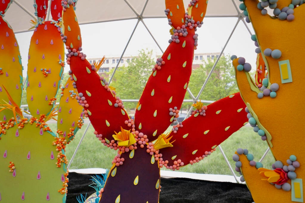 A close-up of a colorful cacti creation.