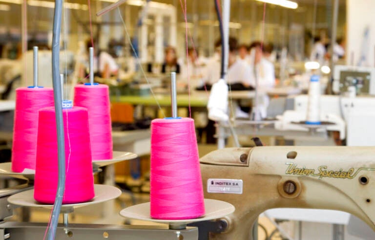 This file photo shows the production department at fashion giant Inditex's headquarters where Zara fashion garments are designed in La Coruna, Spain. Inditex, the retail giant that owns Zara, H&M and many other brands, wants all its clothes to be made from sustainable or recycled fabrics by 2025.  (AP Photo/Jesus Sancho, File)
