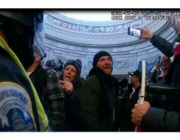 File photo: This image from Metropolitan Police Department body worn camera video and contained in the Statement of Facts supporting an arrest warrant for Pauline Bauer, pointing second to left, taken in the Rotunda of the U.S. Capitol on Jan. 6, 2021, in Washington. (Justice Department via AP)