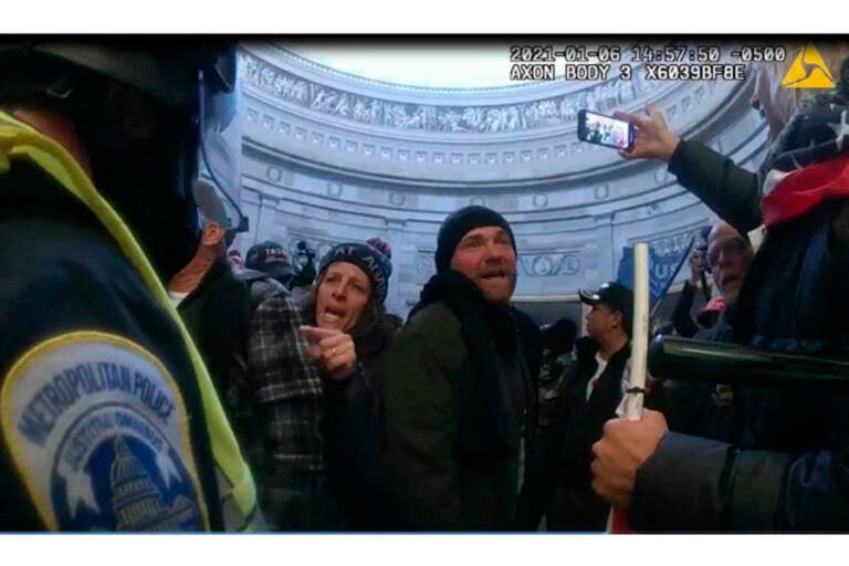 File photo: This image from Metropolitan Police Department body worn camera video and contained in the Statement of Facts supporting an arrest warrant for Pauline Bauer, pointing second to left, taken in the Rotunda of the U.S. Capitol on Jan. 6, 2021, in Washington. (Justice Department via AP)