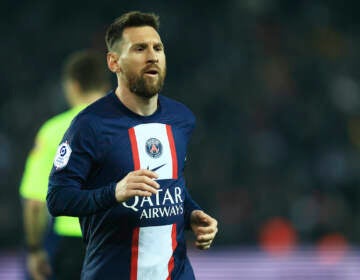 PSG's Lionel Messi runs during the French League One soccer match between Paris Saint-Germain and Lyon at the Parc des Princes stadium in Paris