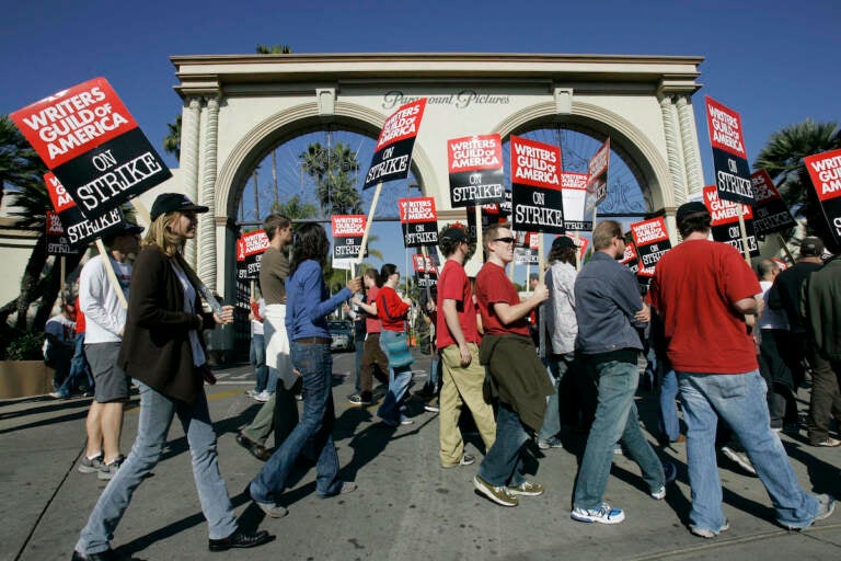 Striking writers walk the picket line outside Paramount Studios in Los Angeles on Dec. 13, 2007. Television and movie writers on Monday, May 1, 2023, declared that they will launch an industrywide strike for the first time since 2007, as Hollywood girded for a shutdown in a dispute over fair pay in the streaming era.  
(AP Photo/Nick Ut, File)