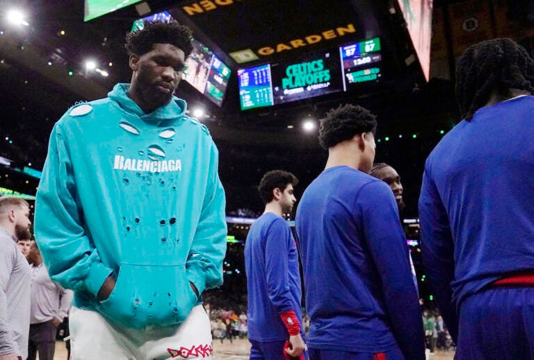 Philadelphia 76ers center Joel Embiid (left) walks on the court during the beginning of the second half of Game 1 against the Boston Celtics in the NBA basketball Eastern Conference semifinals playoff series, Monday, May 1, 2023, in Boston