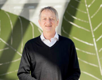 Computer scientist Geoffrey Hinton poses at Google's Mountain View, Calif, headquarters on Wednesday, March 25, 2015. Computer scientists who helped build the foundations of today's artificial intelligence technology are warning of its dangers, but that doesn't mean they agree on the risks or how to prevent disastrous outcomes. (AP Photo/Noah Berger, File)