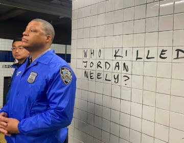 Police officers watch as protesters gather in the Broadway-Lafayette subway station to protest the death of Jordan Neely, Wednesday, May 3, 2023 in New York. Four people were arrested, police said. Neely, a man who was suffering an apparent mental health episode aboard a New York City subway, died this week after being placed in a headlock by a fellow rider on Monday, May 1, according to police officials and video of the encounter. 
(AP Photo/Jake Offenhartz)