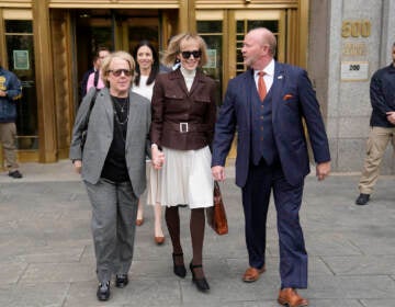 E. Jean Carroll, center, walks out of Manhattan federal court, Tuesday, May 9, 2023, in New York