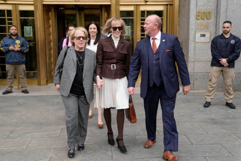 E. Jean Carroll, center, walks out of Manhattan federal court, Tuesday, May 9, 2023, in New York