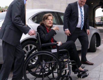 Sen. Dianne Feinstein, D-Calif., is assisted to a wheelchair by staff as she returns to the Senate after a more than two-month absence, at the Capitol in Washington