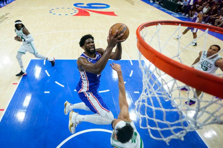 Philadelphia 76ers' Joel Embiid shoots against Boston Celtics' Derrick White during the second half of Game 6 of an NBA basketball playoffs Eastern Conference semifinal, Thursday, May 11, 2023, in Philadelphia