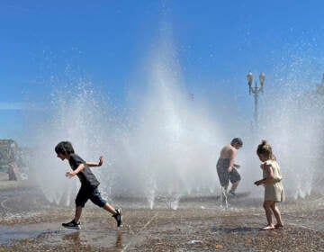 Children play in a fountain to cool off in downtown Portland, Ore., Friday, May 12, 2023. An early May heat wave this weekend could surpass daily records in parts of the Pacific Northwest and worsen wildfires already burning in western Canada, a historically temperate region that has grappled with scorching summer temperatures and unprecedented wildfires fueled by climate change in recent years. 
(AP Photo/Claire Rush)