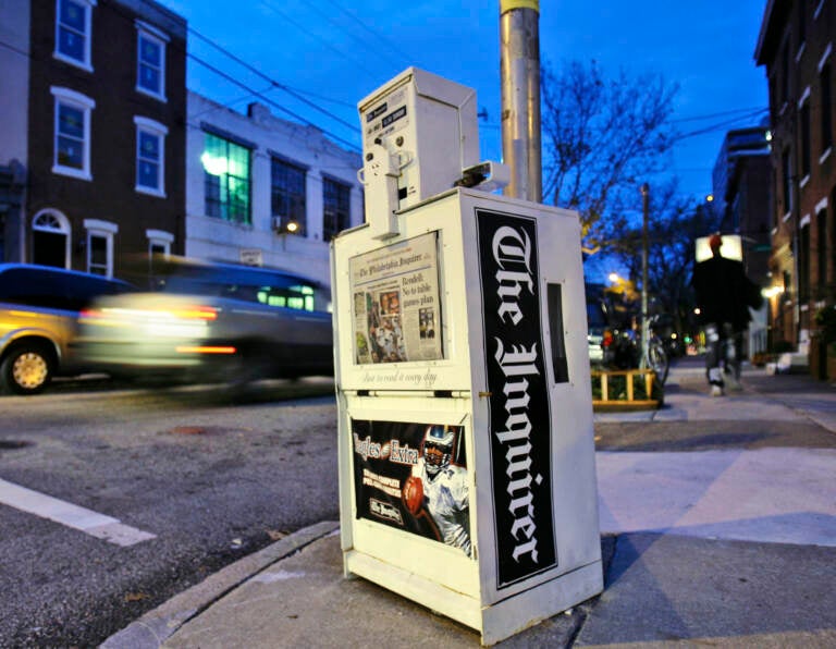 A Philadelphia Inquirer newspaper vending machine stands in Philadelphia
