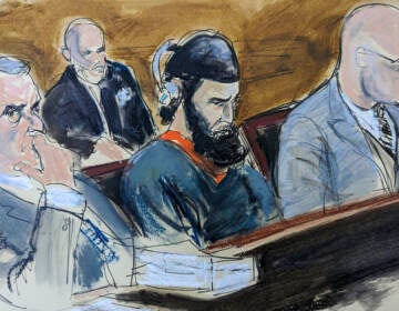 In this courtroom sketch, in federal court in New York, Wednesday, May 17, 2023, Sayfullo Saipov, center, is flanked by his attorneys, David M. Stern (left) and federal Defender Andrew John Dalack, right, during victim impact statements in the sentencing phase of his trial. Saipov, an Islamic extremist who killed eight in a New York bike path attack, was convicted of federal crimes, Jan. 26 2023