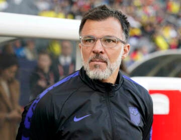 United States interim head coach Anthony Hudson stands near the bench before an international friendly soccer match against Colombia Saturday, Jan. 28, 2023, in Carson, Calif. Hudson quit as interim head coach of the U.S. men's soccer team on Tuesday, May 30, 2023. just two weeks before he was to lead the Americans in the CONCACAF Nations League semifinals. He was replaced by B.J. Callaghan, another holdover from Gregg Berhalter's former staff