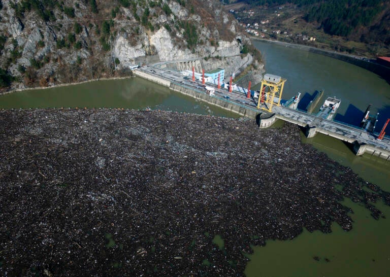 This is aerial photo shows plastic bottles, wooden planks, rusty barrels and other garbage clogging the Drina river near the eastern Bosnian town of Visegrad, Bosnia, on Jan. 5, 2021. . A new study says Earth has pushed past seven out of eight scientifically established safety limits and into “the danger zone,” not just for an overheating planet that’s losing its natural areas, but for well-being of people living on it. The study, published Wednesday, May 31, 2023, for the first time it includes measures of “justice,” which is mostly about preventing harm for groups of people. (AP Photo/Eldar Emric)