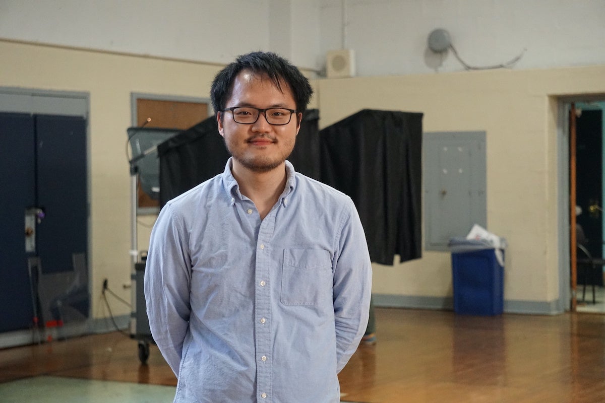 Chi-hyun Kim serves as a judge of elections in West Philly. He's been a poll worker for about 4 years and said 'Democracy is important'. 
(Sam Searles/WHYY)