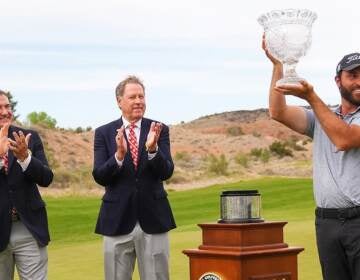 Braden Shattuck (right) lifts the trophy after winning the PGA Professional Championship